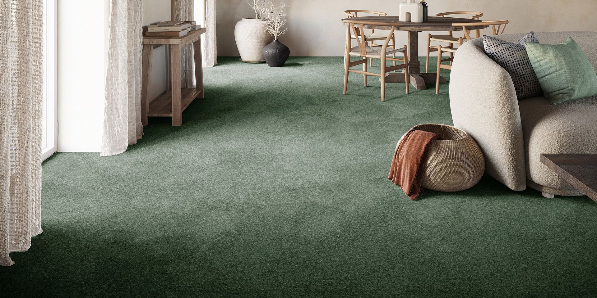 Green fitted carpet through a living and dining room
