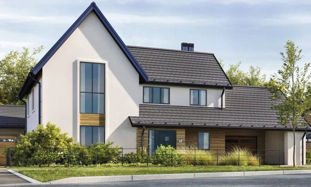 Tall windows on a cream rendered house with a dark roof